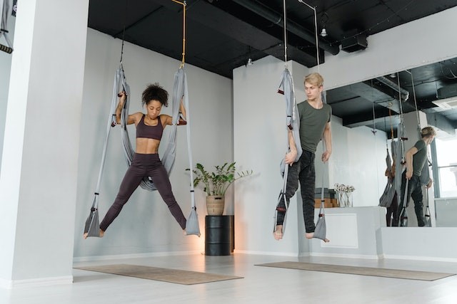 What Is A Hammock and What Are Its 5 Important Uses? 3 woman doing yoga with Hammock