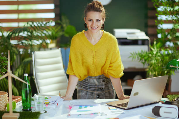 Designing a Health-Friendly Workspace: Your Guide to Well-being 3 Photo of a women at her workplace