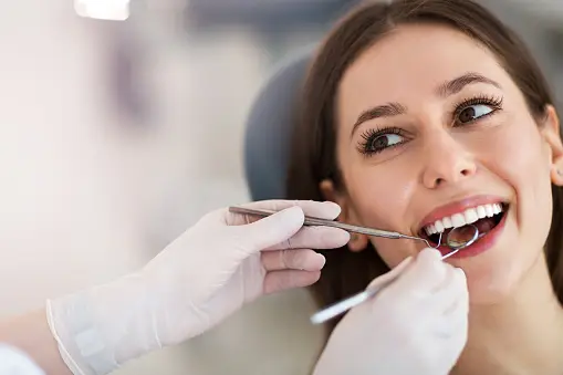 Beyond the Brush: The Comprehensive Guide to Optimal Dental Care Practices 3 Photo of a women having Dental Care